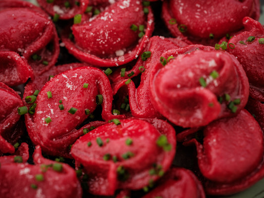 red tortellacci mozzarella/harissa/chive butter