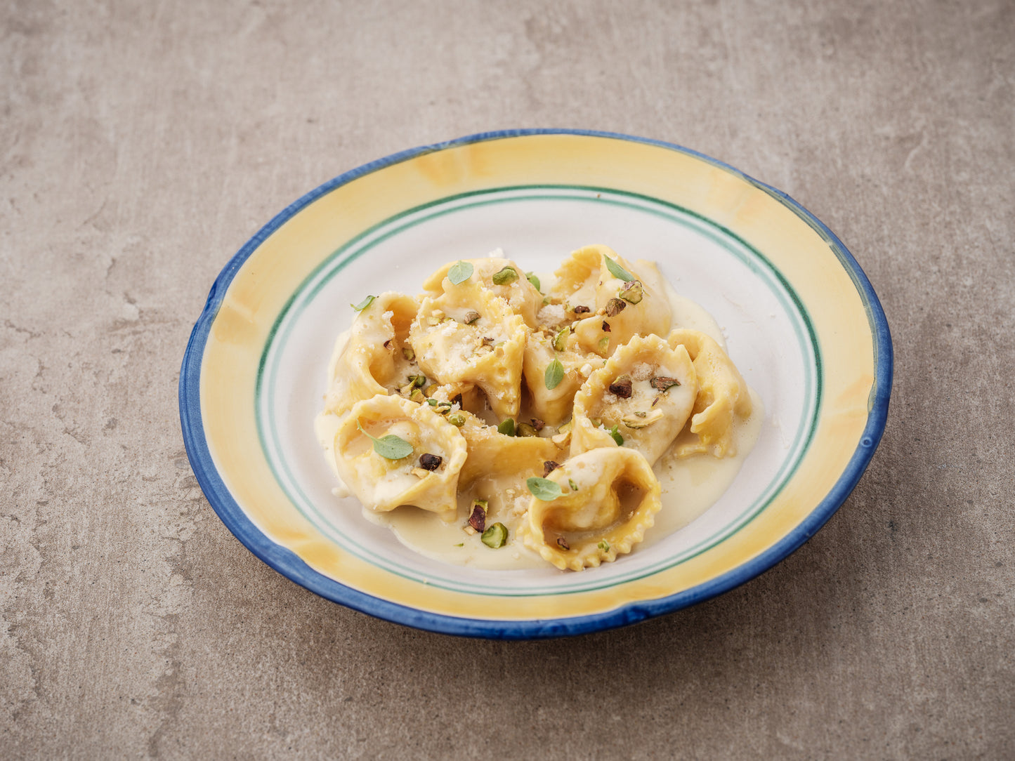 Agnolotti Mortadella/cheese sauce/pistacchio crunch